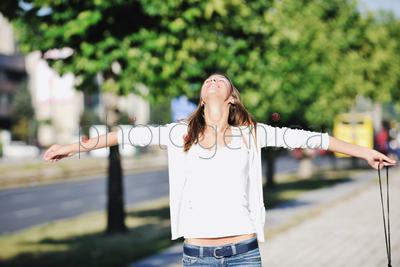 beautiful young woman have fun and relax at city street on beautiful sunny day