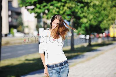 beautiful young woman have fun and relax at city street on beautiful sunny day