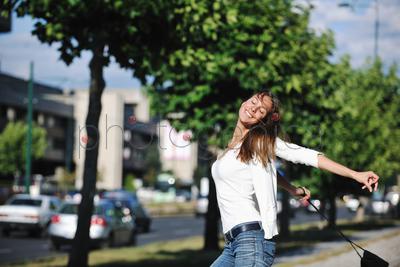 beautiful young woman have fun and relax at city street on beautiful sunny day