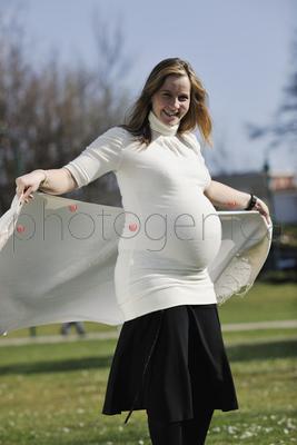 happy young pregnant womant have fun outdoor in nature at sunny day