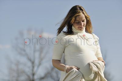 happy young pregnant womant have fun outdoor in nature at sunny day